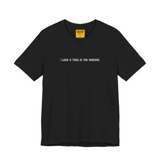 black t-shirt with white text 'I LOVE A TACO IN THE MORNING'