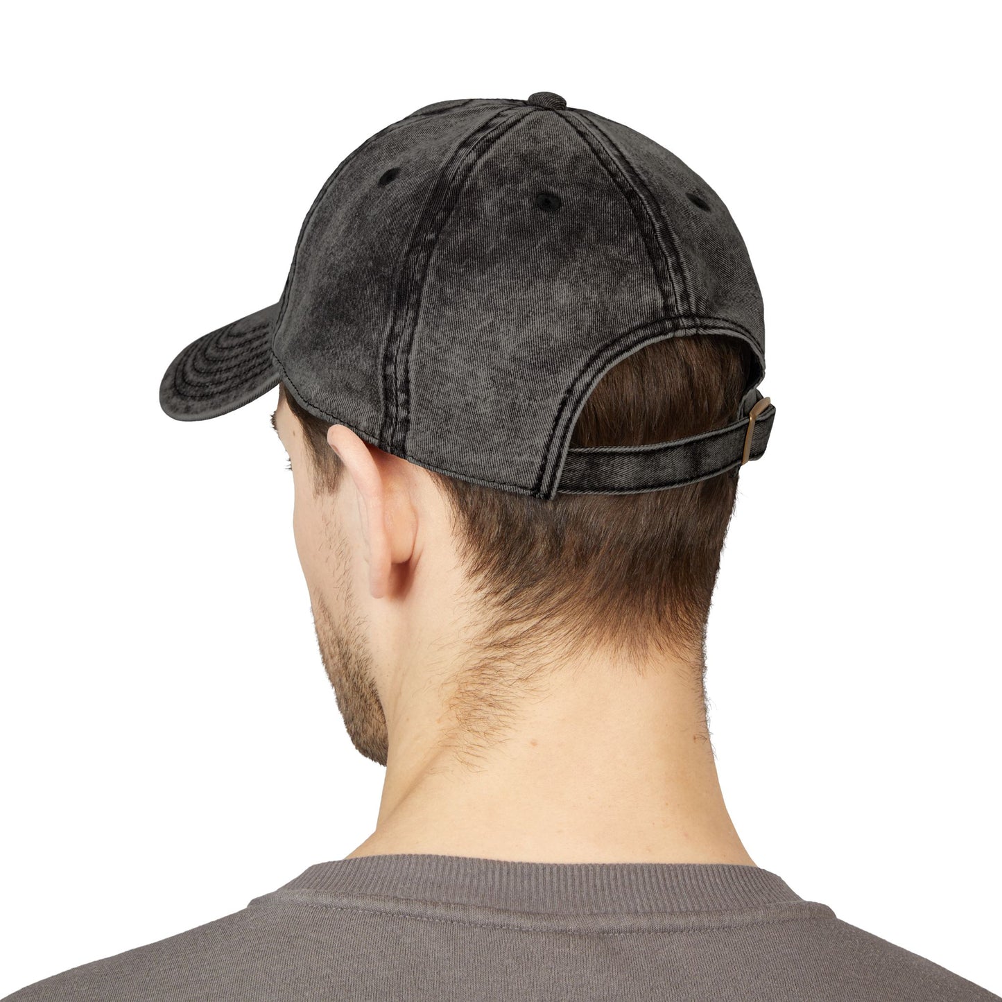 Person wearing a black denim cap from behind on a white background bakc view