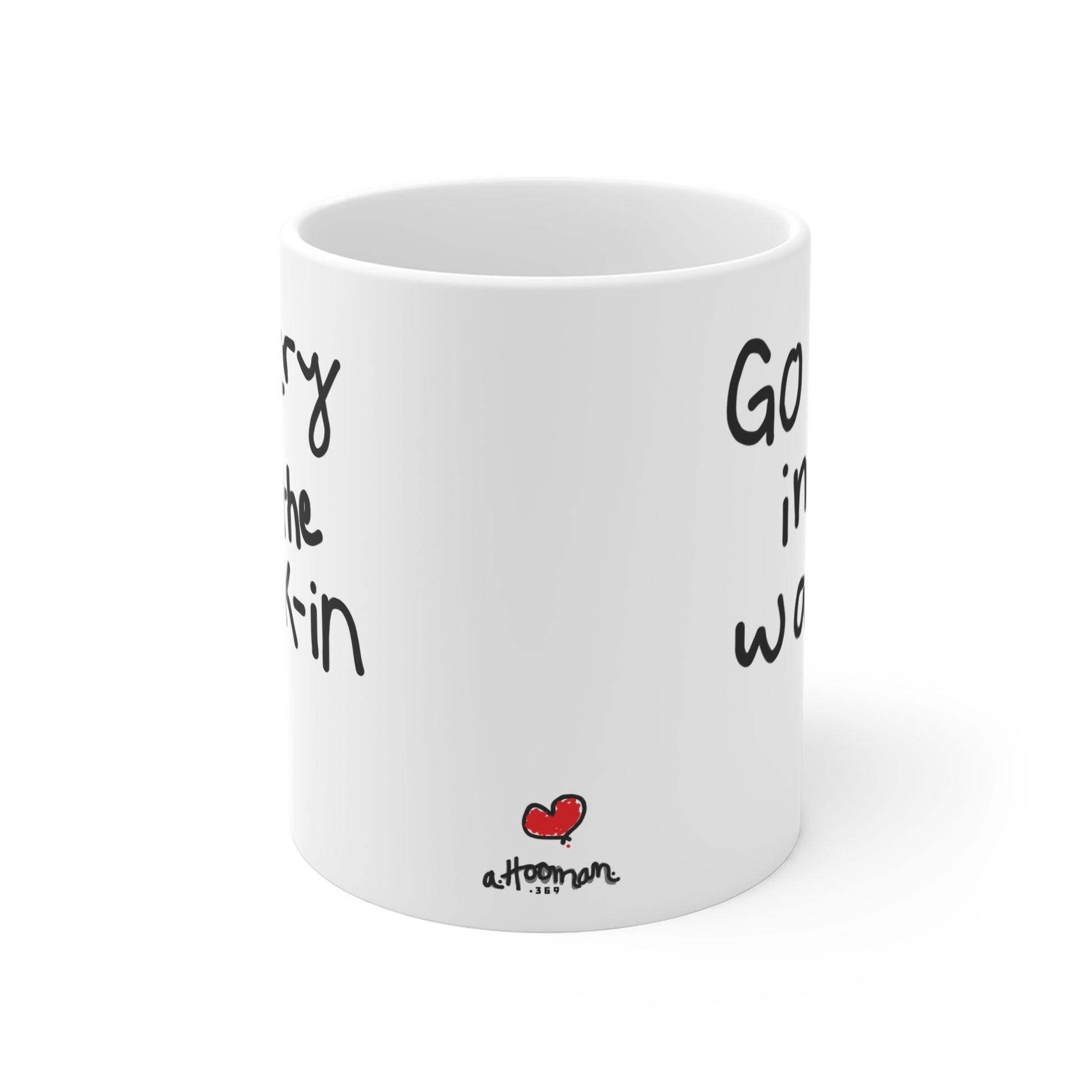 White mug with black text and a red heart by a.hooman on a white background