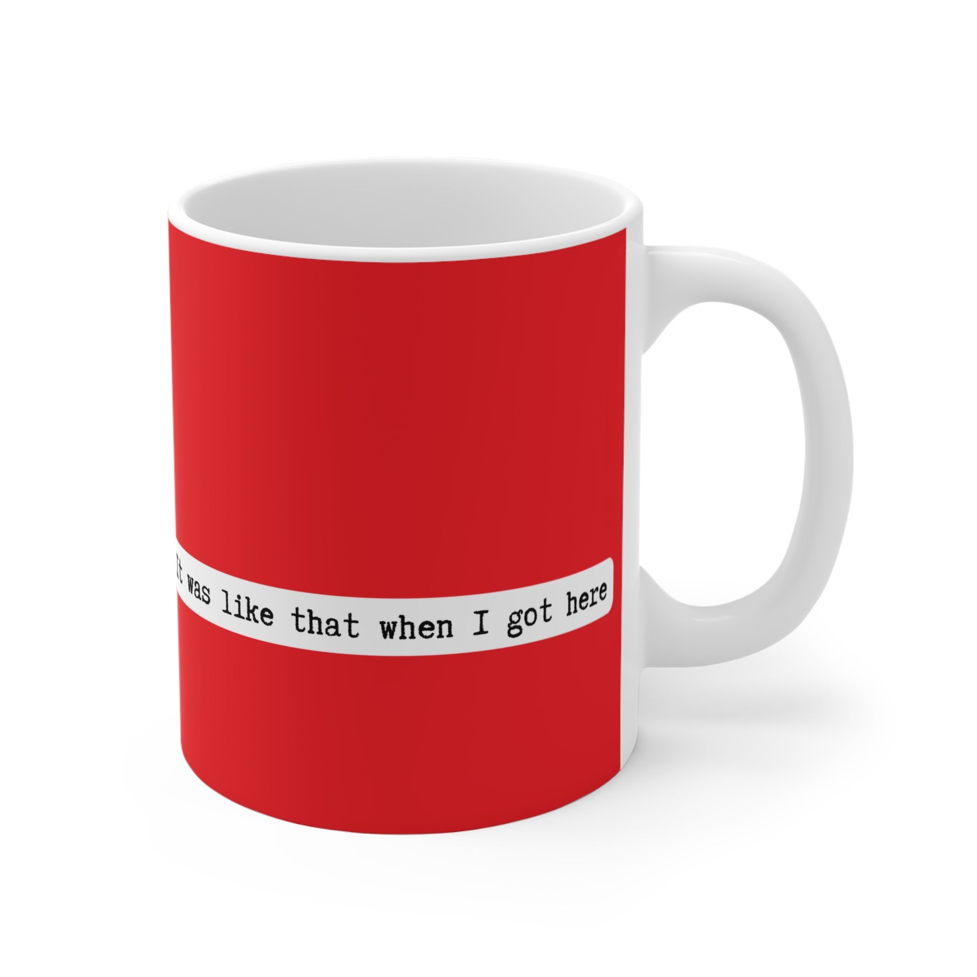 Red mug with white text on a white background