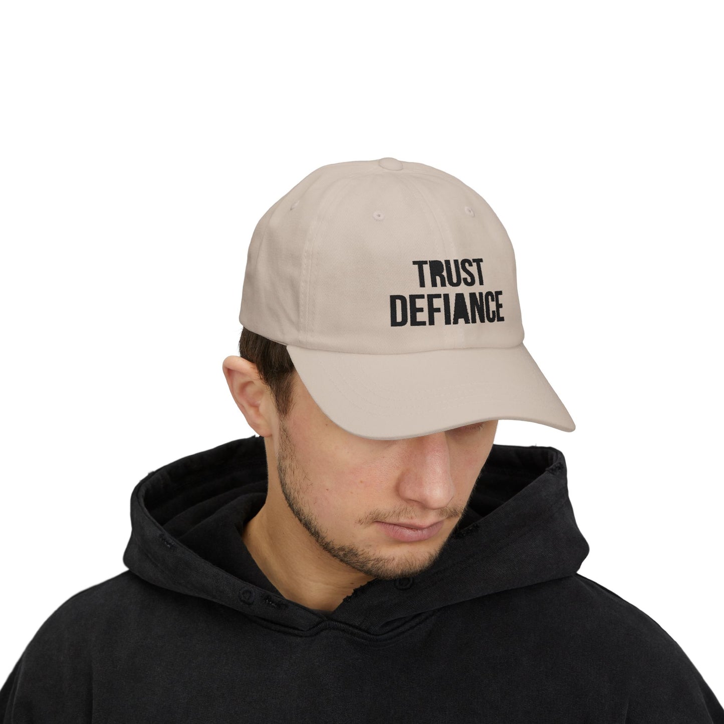 Person wearing TRUST DEFIANCE dad cap with black embroidery - free thinker streetwear