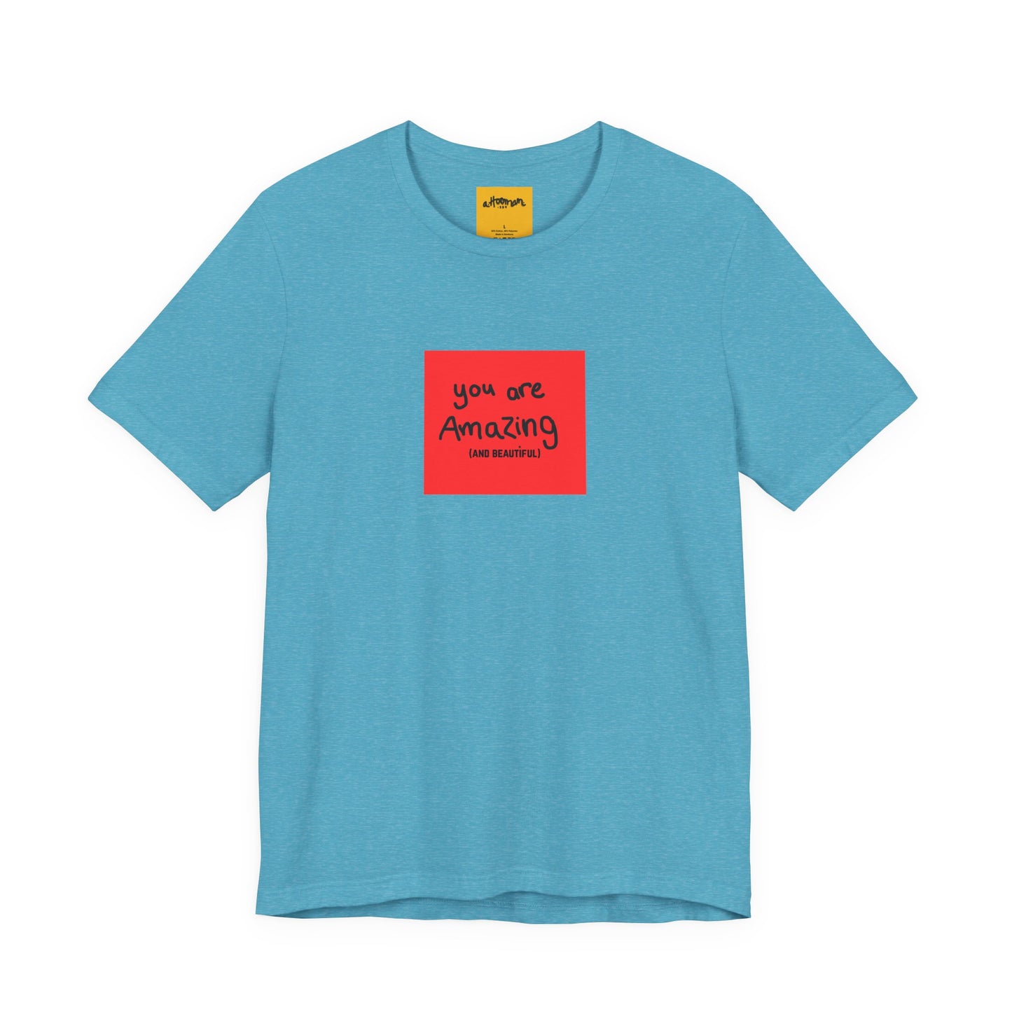 blue t-shirt with a red square and text  reads you are amazing and beautiful on a white background