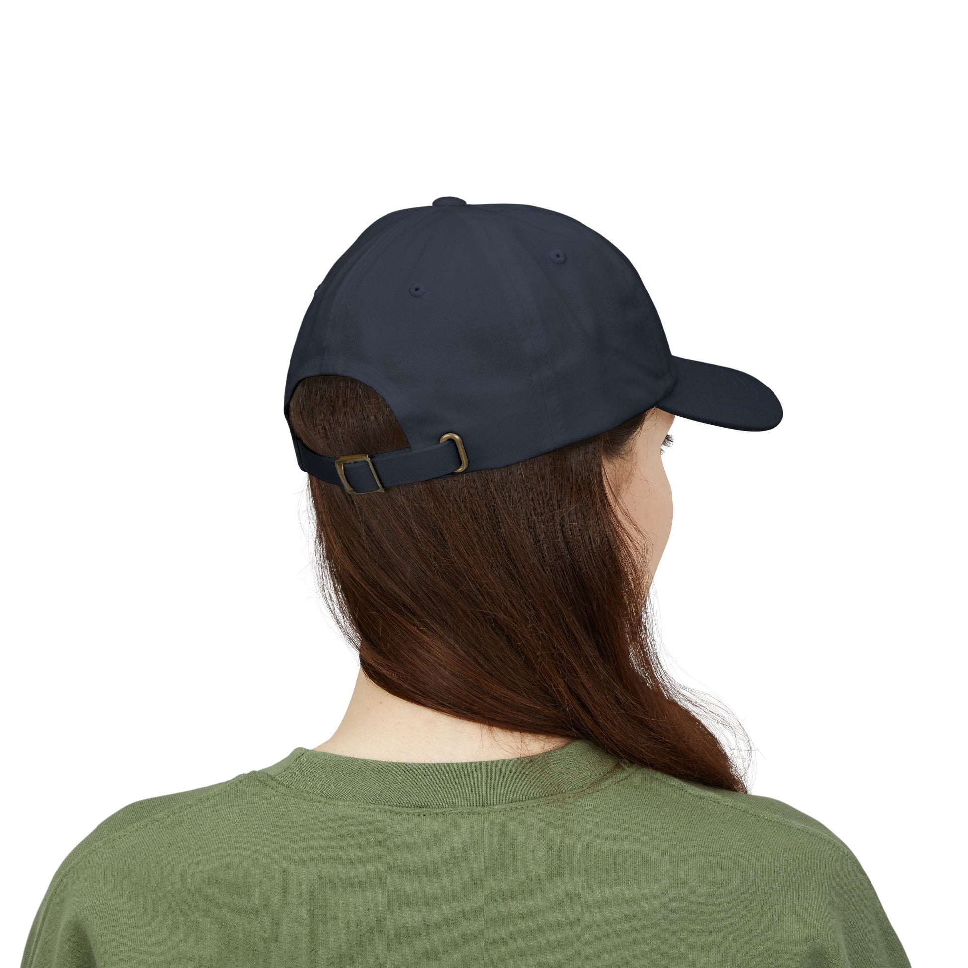 person wearing navy classic dad cap with white embroidered TRUST DEFIANCE text - unstructured cotton hat-back view