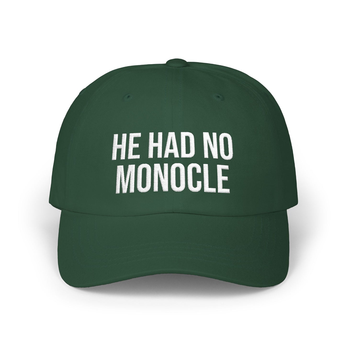 Green cap with 'HE HAD NO MONOCLE' text on a white background