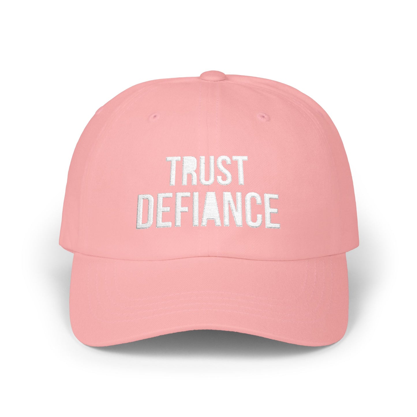 pink classic dad cap with white embroidered TRUST DEFIANCE text - unstructured cotton hat