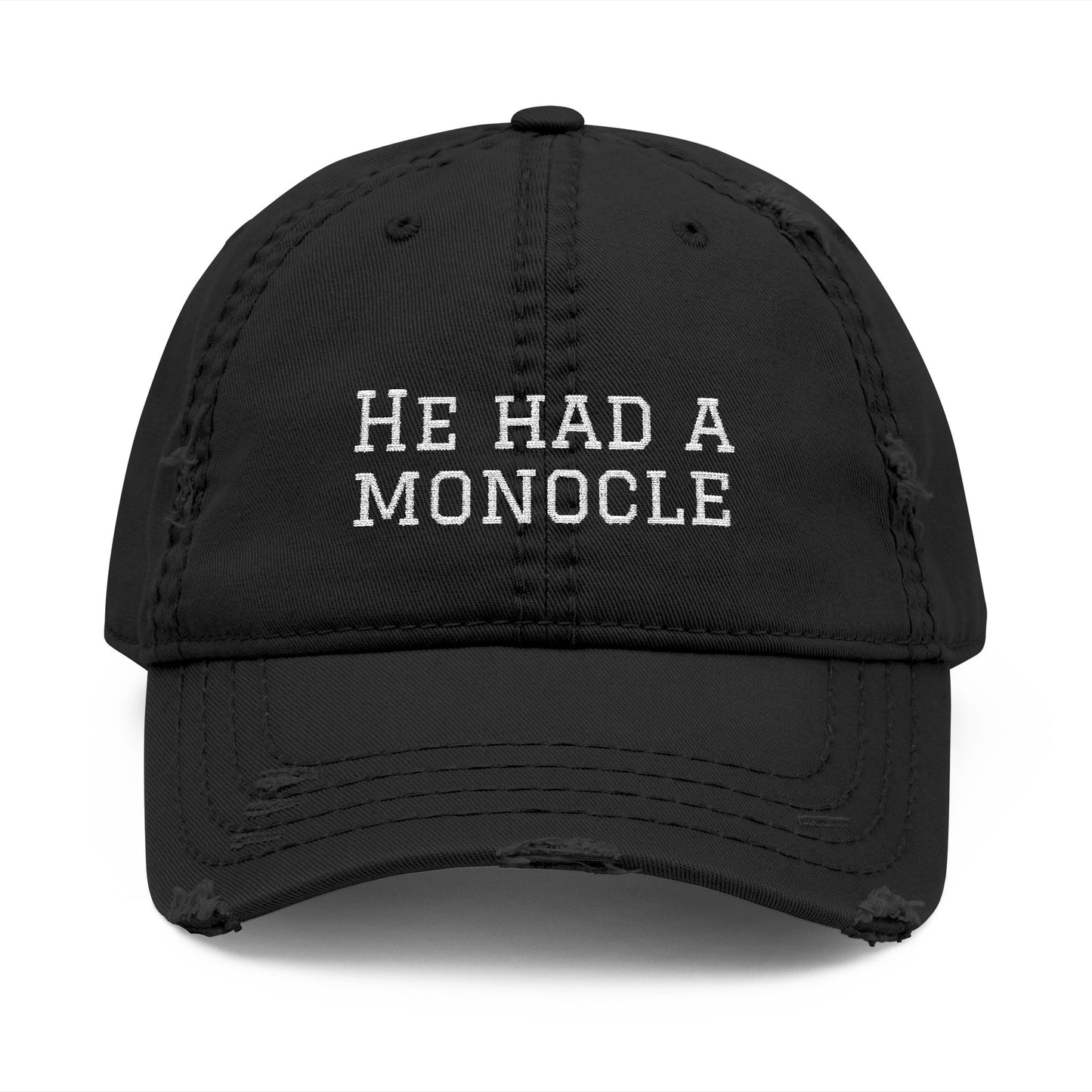 Black cap with 'He Had a Monocle' text on a white background