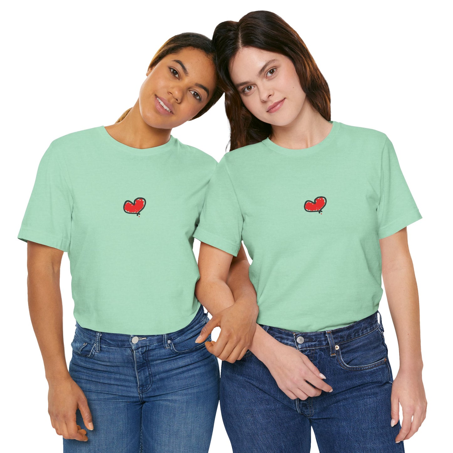Two people wearing matching light green t-shirts with a red heart design on a white background