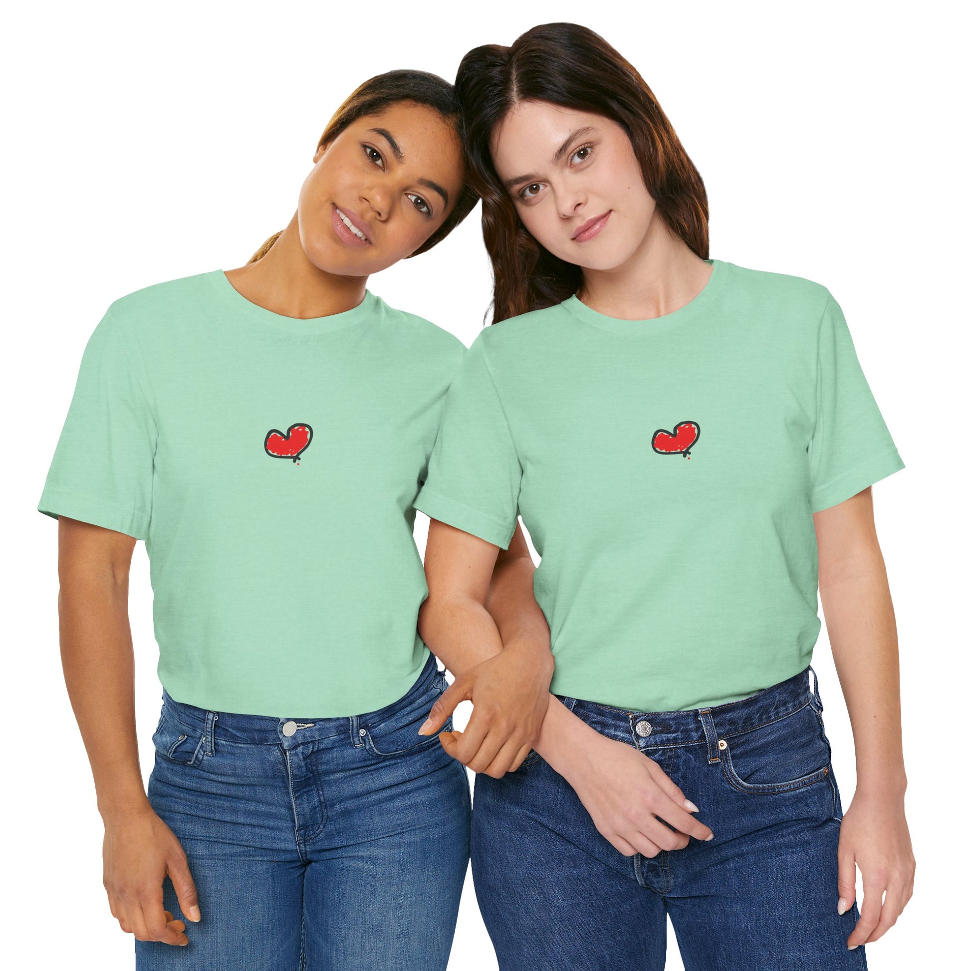 Two people wearing matching light green t-shirts with a red heart design on a white background