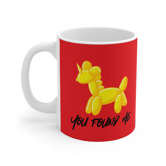 Red mug with yellow balloon unicorn design and text on a white background