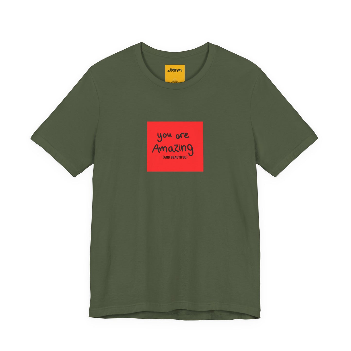 Green t-shirt with a red square featuring 'you are Amazing' text on a white background