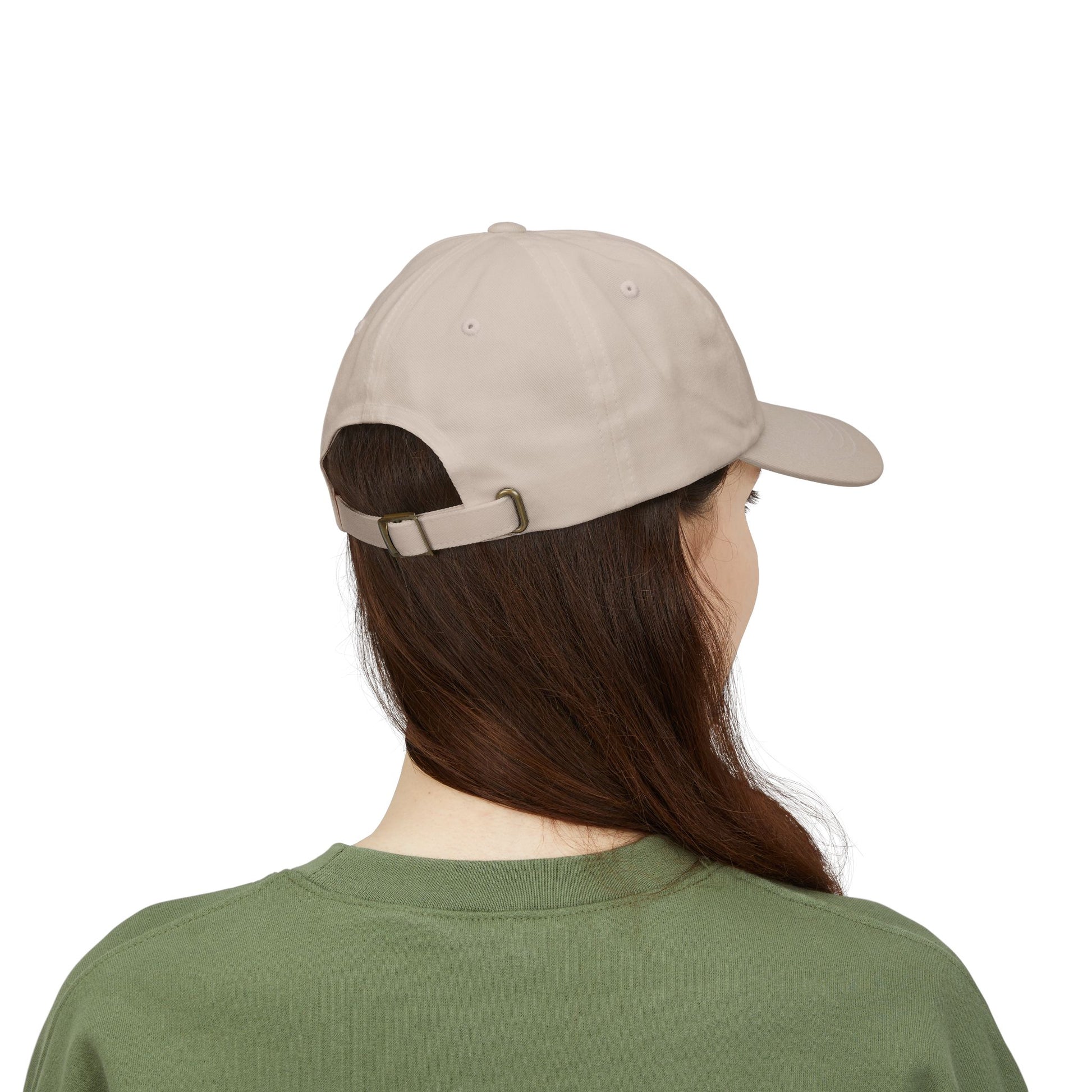 Person wearing a beige cap and green shirt on a white background back view