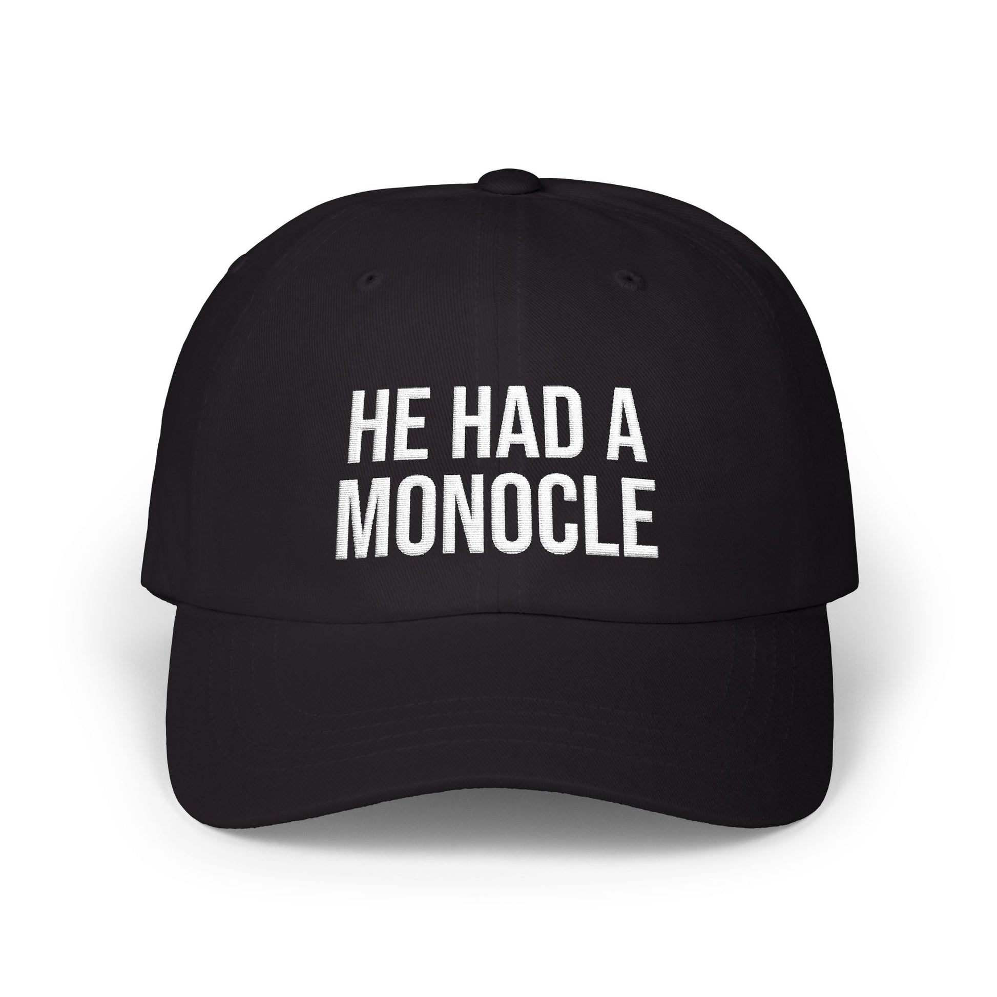 Black cap with 'HE HAD A MONOCLE' text on a white background