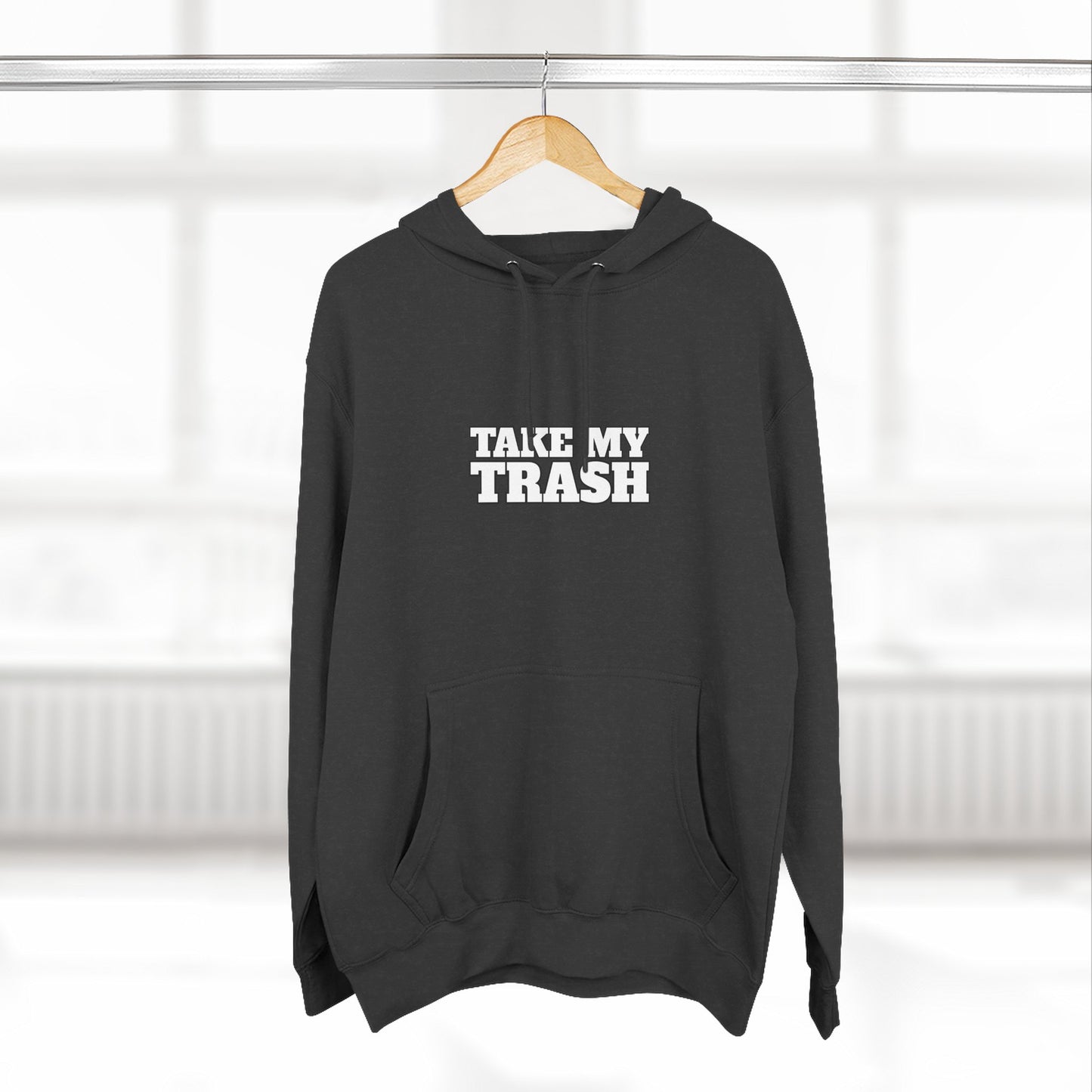 Black pullover hoodie with TAKE MY TRASH text - funny breakup hoodie anti-Valentine's on hanger