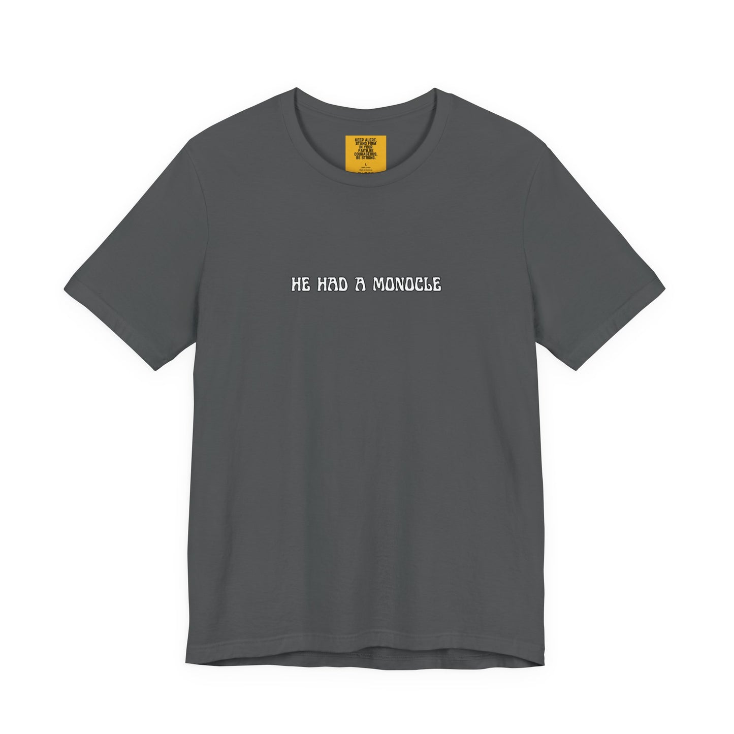 Gray t-shirt with text 'HE HAD A MONOCLE' on a white background front and Keep Alert positive affirmation yellow neck label