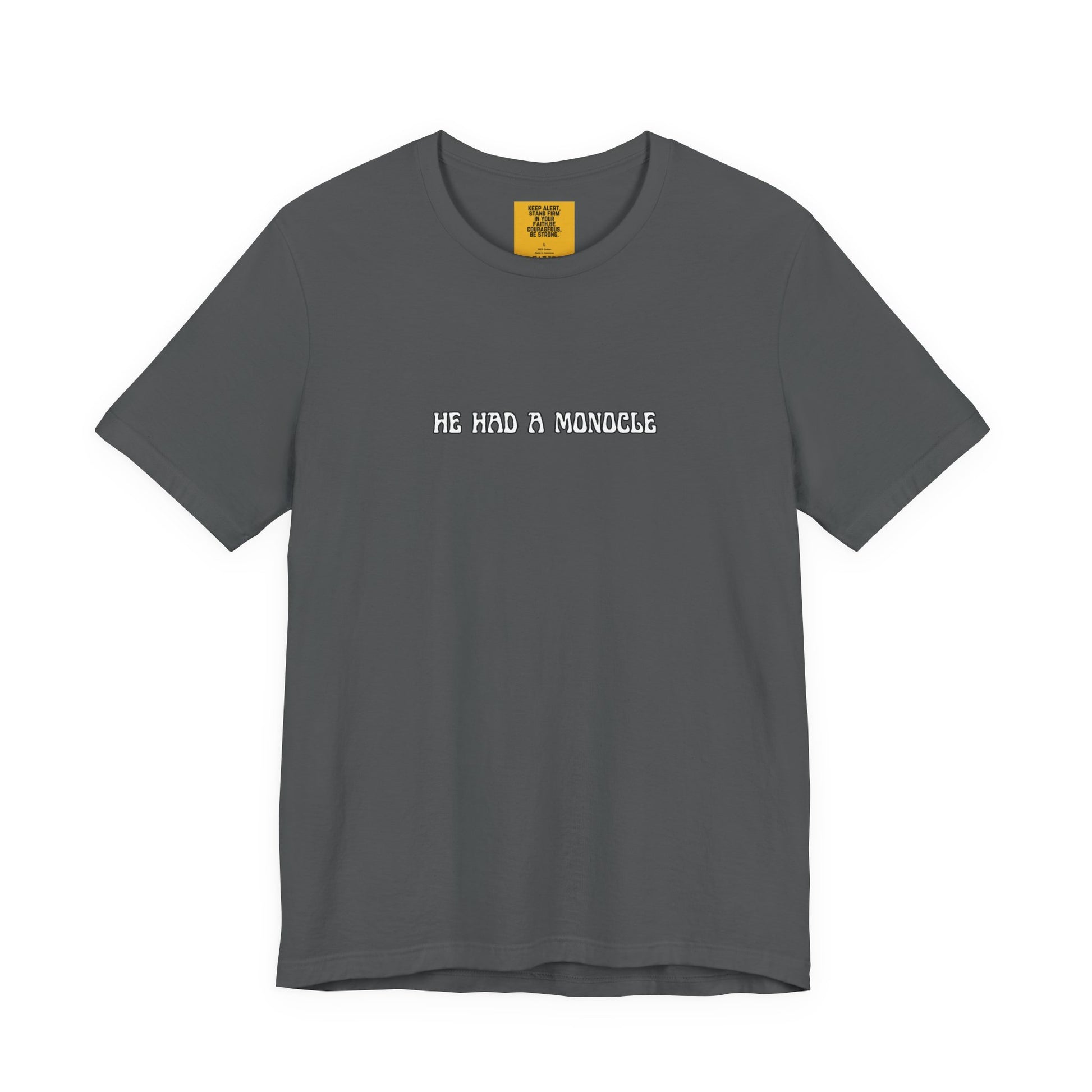 Gray t-shirt with text 'HE HAD A MONOCLE' on a white background front and Keep Alert positive affirmation yellow neck label