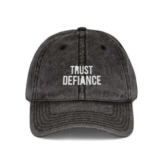 Black cap with 'Trust Defiance' text on a white background